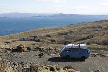 Vintage campervan and dramatic landscape. 