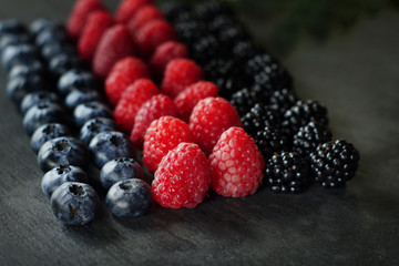 blueberries, raspberries and blackberries on slate, berries, summer crop