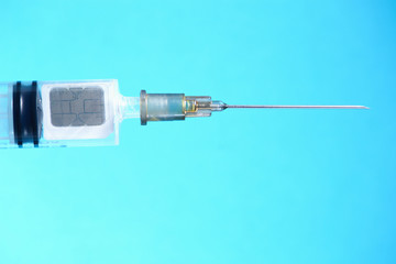Syringe with a chip. The concept of the theory of conspiracy and implantation of vaccinated chips....
