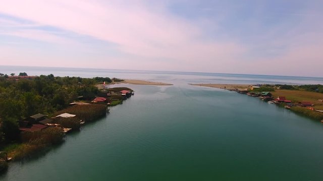 Aerial Flyover Of Beautiful Ada Bojana In Montenegro.