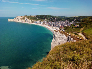 Fototapeta na wymiar White cliffs edge and beach and Village of Étretat. Normandy. France.