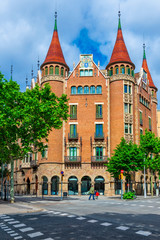Fototapeta na wymiar Street with beautiful building in Barcelona, Catalonia, Spain. Architecture and landmark of Barcelona.