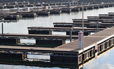 Boat Dock & Basin Marina Empty Awaiting Boating & Shipping Season on Water, Lake, River & Ocean