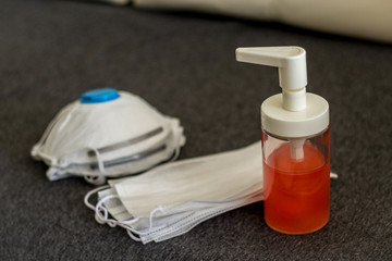 soap, medical gloves and respirators - personal protective equipment on the table at home

