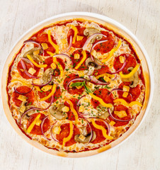 Pizza with salami and mushrooms