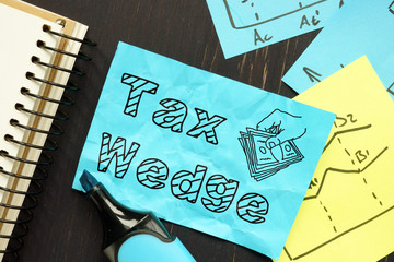 Tax Wedge is shown on the conceptual business photo