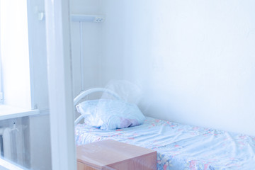 isolated hospital room with a bed and medical equipment in the hospital. Patient room in quarantine...