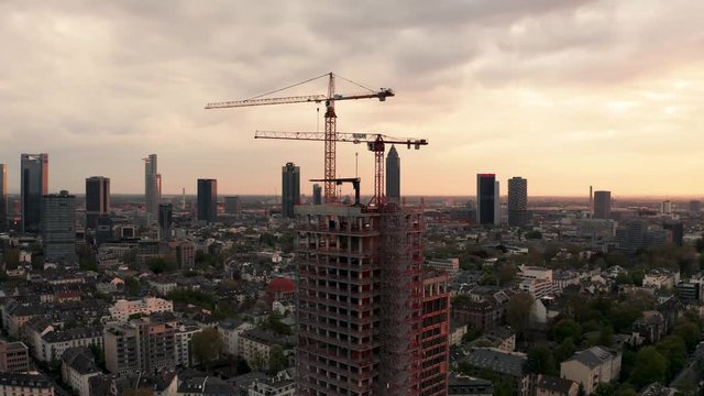 Slow orbit move around skyline of frankfurt in golden hour