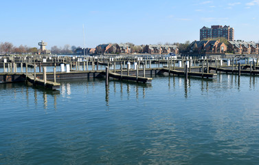 Fototapeta na wymiar Buffalo, NY Boat Dock & Erie Basin Marina Empty Awaiting Boating & Shipping Season on Water, Lake, River & Ocean