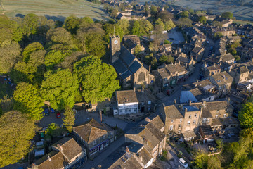 Aerial Shot of Haworth main street, near Keighley, West Yorkshire home of the Bronte Sisters, featuring St Michael & All Angels Church, where Maria Brontë, Patrick Brontë, Elizabeth Brontë, are buried
