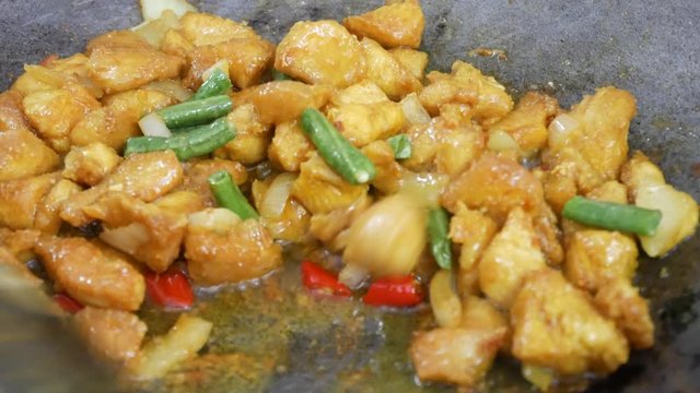 Turmeric fried chicken. The chicken is cut into small pieces and fried with turmeric. Fry in a pan using hot cooking oil. The origin of this dish is from Thailand.