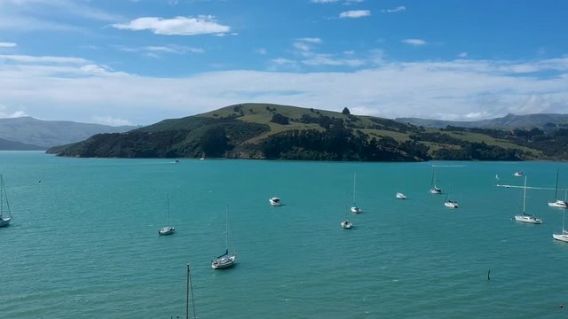 Aerial view of harbor and mountains surrounding the town of Akaroa.