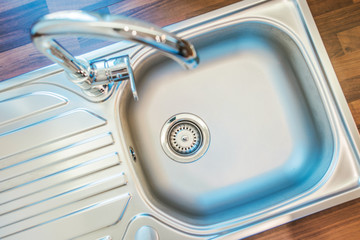 Single Bowl Stainless Steel Kitchen Sink And Faucet.