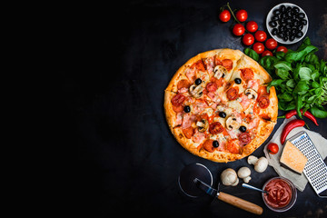 Traditional Italian pizza, vegetables, ingredients on a dark metallic background. Pizza is cooking in the oven. Pizza menu. View from above. Space for text. - obrazy, fototapety, plakaty