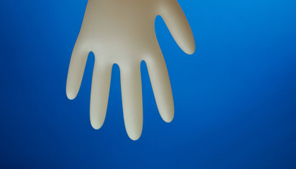 Funny character made of rubber glove. Copy space. Medicine for kids. Medical gloves. Entertain children at hospital 