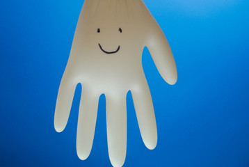 Funny character made of rubber glove. Copy space. Medicine for kids. Medical gloves. Entertain children at hospital 