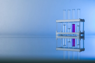 conceptual background with chemical flasks and lab glassware. lab glassware on glass table with copy space.