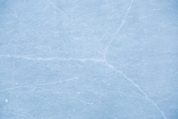 texture of ice skates traces on the blue ice
