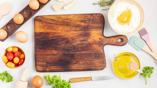 Stop motion animation with cutting board and baking ingredients. Recipe blog, cooking classes concept with copy space