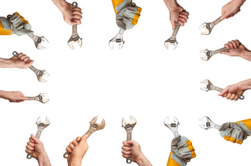 place for text on the background of a wrench in a hand. the banner depicts hands holding tools.hand of the master holds an adjustable wrench