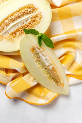 Fresh assortment melon with mint  on white