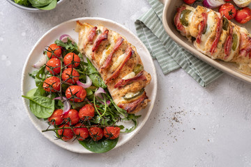 Baked hasselback chicken breast stuffed with bacon, cheese and jalapenos