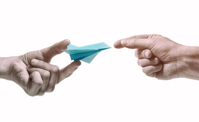Person gives paper plane to another human. Concept of booking plane ticket, charters, tour. ...