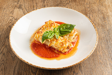 tasty lasagna with tomato sauce