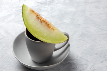 Fresh assortment melon with mint  on gray