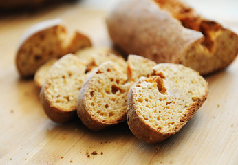 Sliced white yeast-free curd wheat bread on wooden board
