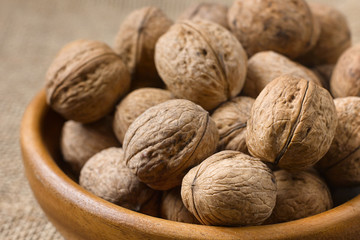 Closeup nuts in a wooden plate