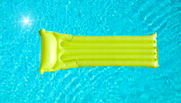 green inflatable mattress on blue pool