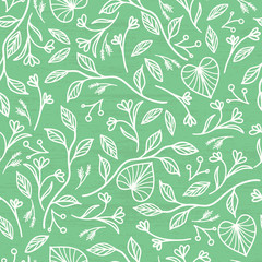 Vector decorative branches with leaves on green background. Seamless pattern
