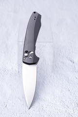 The knife in an upright position is inclined at an angle.