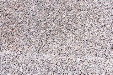 Scree is used in the construction industry background and texture. Small road stone background, Granite gravel texture.