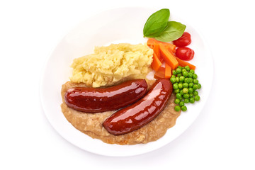 Baked sausages with mashed potatoes, isolated on white background