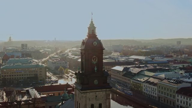 Parallax drone shot orbiting a church in Gothenburg Sweden at dawn