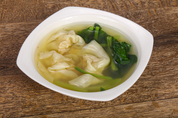 Asian traditional Wonton soup with herbs