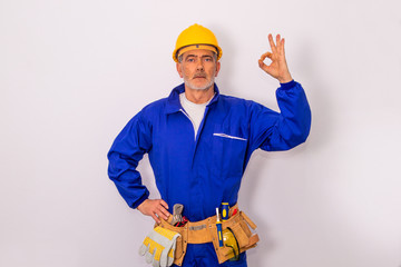 construction worker with tools and helmet isolated on white background
