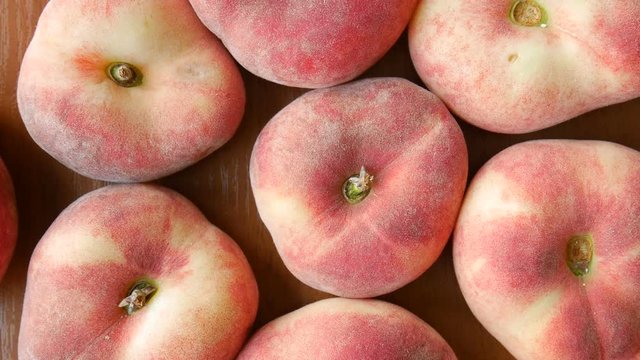 Juicy fig peaches on the table.