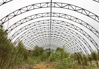 frame of the old hangar on a background of cloudy sky
