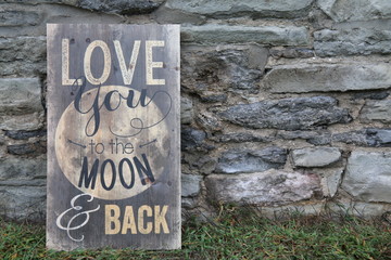 antique sign against old brick wall