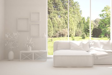 White living room with sofa and summer landscape in window. Scandinavian interior design. 3D illustration