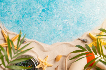 vacation and travel concept, Flat lay top view copy space, exotic concept. Creative layout of sand waves and sea, summer beach background with shell, sea star, compass life preserver and blurred Palm