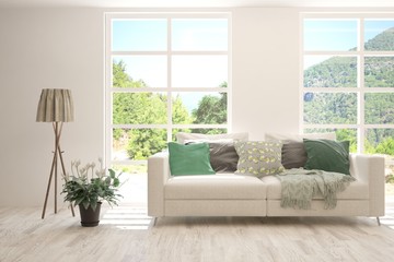White living room with sofa and summer landscape in window. Scandinavian interior design. 3D illustration