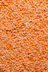 Orange lentils nicely laid out. food background. Top view. copy space. Vegetarian food.