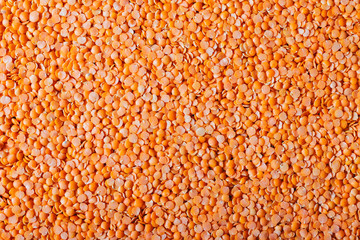 Orange lentils nicely laid out. food background. Top view. copy space. Vegetarian food.