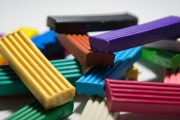 Colorful children&rsquo;s plasticine. All the colors of the rainbow. Mass for the foot