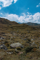 Beautiful Elbrus hid in the clouds. Cloudy weather in the mountains, sleeping volcano, snow in the mountains.