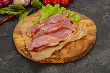 Sliced smoked duck breast served salad